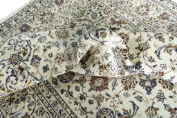 Surface texture of 2000s Kashan rug with natural Wool and intricate pattern
