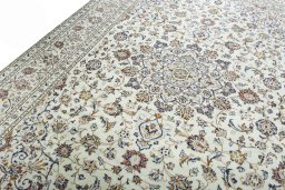 Backside of handmade 2000s Kashan rug showing knot structure and weave density