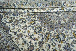 Close-up detail of 2000s Kashan rug from Iran / Persia showing Wool weave