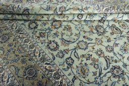 Close-up detail of 2000s Kashan rug from Iran / Persia showing Wool weave