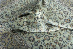 Surface texture of 2000s Kashan rug with natural Wool and intricate pattern