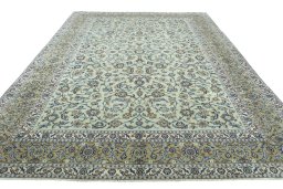 Surface texture of 2000s Kashan rug with natural Wool and intricate pattern