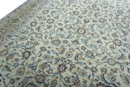 Backside of handmade 2000s Kashan rug showing knot structure and weave density