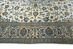 Corner detail of New Kashan rug showing border pattern and Wool pile