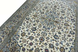 Backside of handmade New Kashan rug showing knot structure and weave density