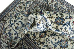 Close-up detail of 2000s Kashan rug from Iran / Persia showing Wool weave