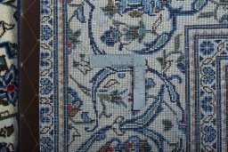 Surface texture of 2000s Kashan rug with natural Wool and intricate pattern
