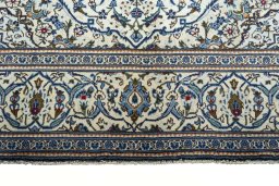 Close-up detail of 2000s Kashan rug from Iran / Persia showing Wool weave