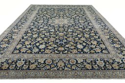 Surface texture of 2000s Kashan rug with natural Wool and intricate pattern