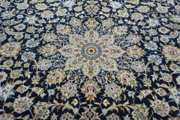 Central medallion detail of 2000s Kashan rug from Iran / Persia