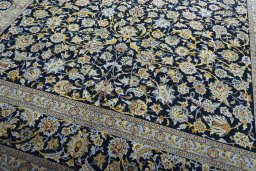 Close-up detail of 2000s Kashan rug from Iran / Persia showing Wool weave