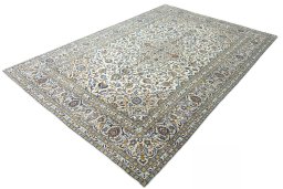 Corner detail of 2000s Kashan rug showing border pattern and Wool pile
