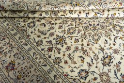 Close-up detail of 2000s Kashan rug from Iran / Persia showing Wool weave