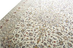 Backside of handmade 2000s Kashan rug showing knot structure and weave density