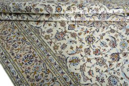 Close-up detail of 2000s Kashan rug from Iran / Persia showing Wool weave
