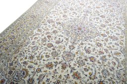 Backside of handmade 2000s Kashan rug showing knot structure and weave density