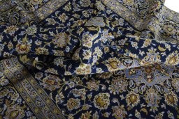 Surface texture of 2000s Kashan rug with natural Wool and intricate pattern