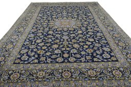 Surface texture of 2000s Kashan rug with natural Wool and intricate pattern