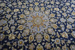 Central medallion detail of 2000s Kashan rug from Iran / Persia