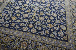 Close-up detail of 2000s Kashan rug from Iran / Persia showing Wool weave