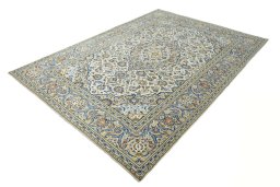 Corner detail of 2000s Kashan rug showing border pattern and Wool pile