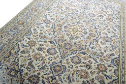 Backside of handmade 2000s Kashan rug showing knot structure and weave density