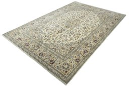 Corner detail of 2000s Kashan rug showing border pattern and Wool pile