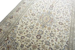 Backside of handmade 2000s Kashan rug showing knot structure and weave density
