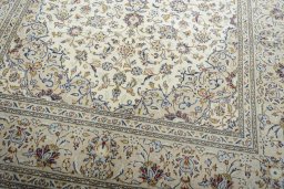 Close-up detail of 2000s Kashan rug from Iran / Persia showing Wool weave