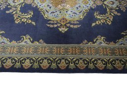 Corner detail of 2000s Kashan rug showing border pattern and Wool pile
