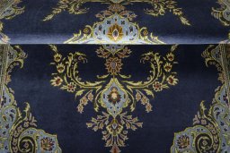 Close-up detail of 2000s Kashan rug from Iran / Persia showing Wool weave