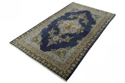 Corner detail of 2000s Kashan rug showing border pattern and Wool pile