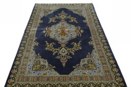 Surface texture of 2000s Kashan rug with natural Wool and intricate pattern