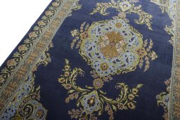Backside of handmade 2000s Kashan rug showing knot structure and weave density