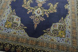 Close-up detail of 2000s Kashan rug from Iran / Persia showing Wool weave