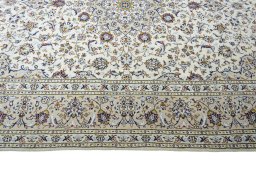Corner detail of 2000s Kashan rug showing border pattern and Wool pile