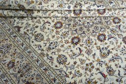 Close-up detail of 2000s Kashan rug from Iran / Persia showing Wool weave