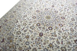 Backside of handmade 2000s Kashan rug showing knot structure and weave density