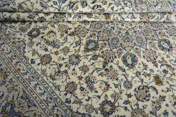 Close-up detail of 2000s Kashan rug from Iran / Persia showing Wool weave