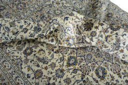 Surface texture of 2000s Kashan rug with natural Wool and intricate pattern