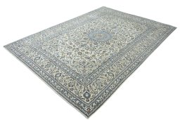Corner detail of New Kashan rug showing border pattern and Wool pile