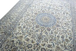 Backside of handmade New Kashan rug showing knot structure and weave density