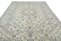 Surface texture of 2000s Kashan rug with natural Wool and intricate pattern