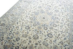 Backside of handmade 2000s Kashan rug showing knot structure and weave density