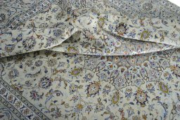 Surface texture of 2000s Kashan rug with natural Wool and intricate pattern