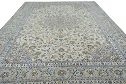 Surface texture of 2000s Kashan rug with natural Wool and intricate pattern