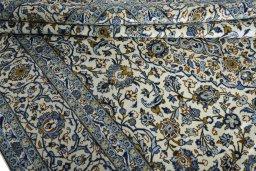 Close-up detail of 2000s Kashan rug from Iran / Persia showing Wool weave