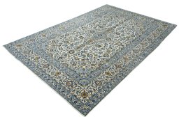 Corner detail of 2000s Kashan rug showing border pattern and Wool pile