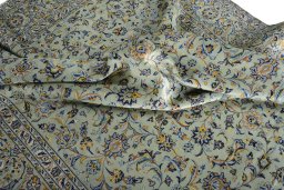 Surface texture of 2000s Kashan rug with natural Wool and intricate pattern