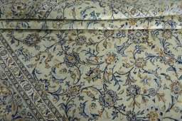 Close-up detail of 2000s Kashan rug from Iran / Persia showing Wool weave